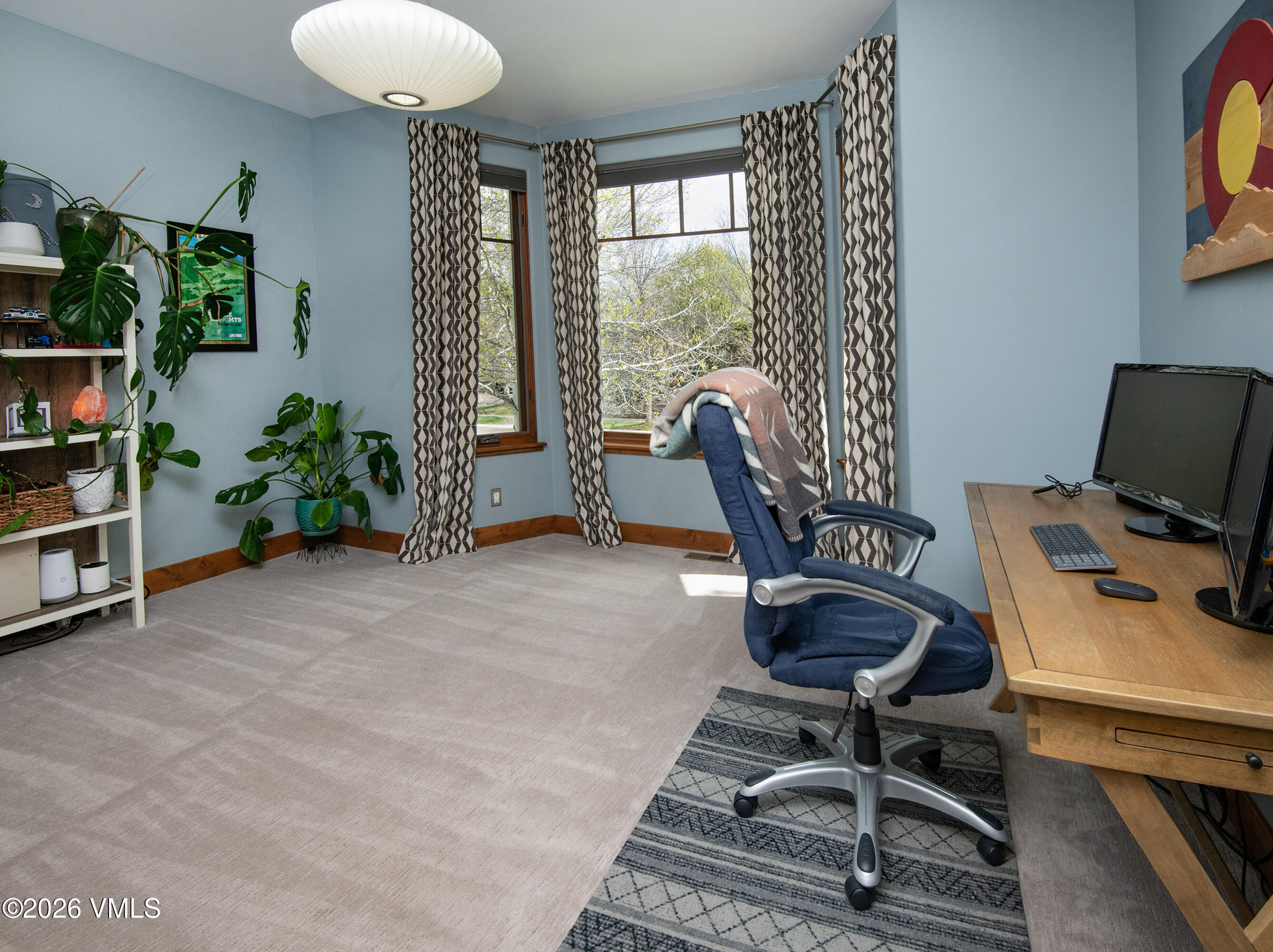 135 Palmer Loop Eagle, CO 81631 - Photo 8 of 54 a view of a workspace with furniture and a window