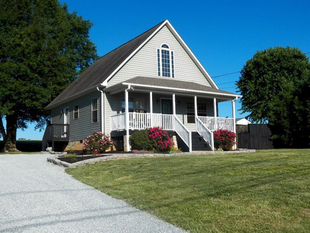 Beautiful chalet style home across the street from the lake.  Low maintenance exterior with side entrance door from new gravel driveway into mud/laundry room with tile floor.  