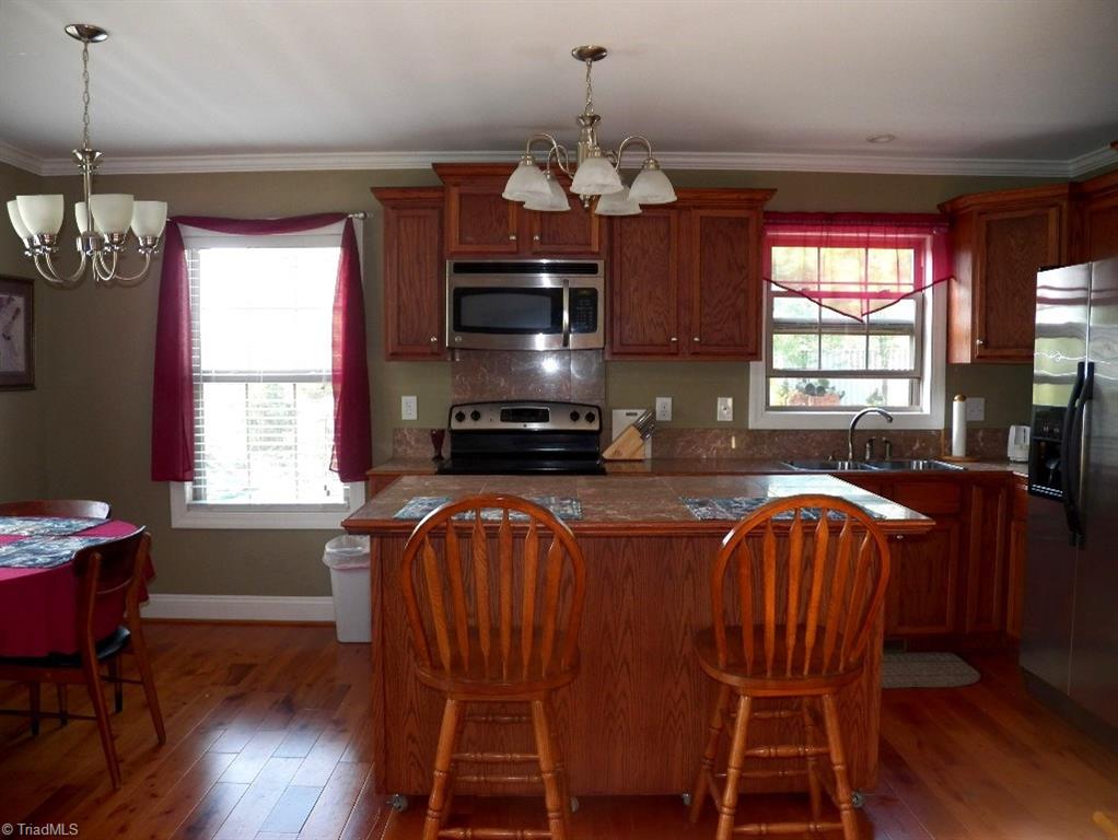 859 Riverview Rd Extension Lexington, NC 27292 - Photo 14 of 26 Another view of the kitchen. Window over the kitchen sink looks out to the side yard and driveway.