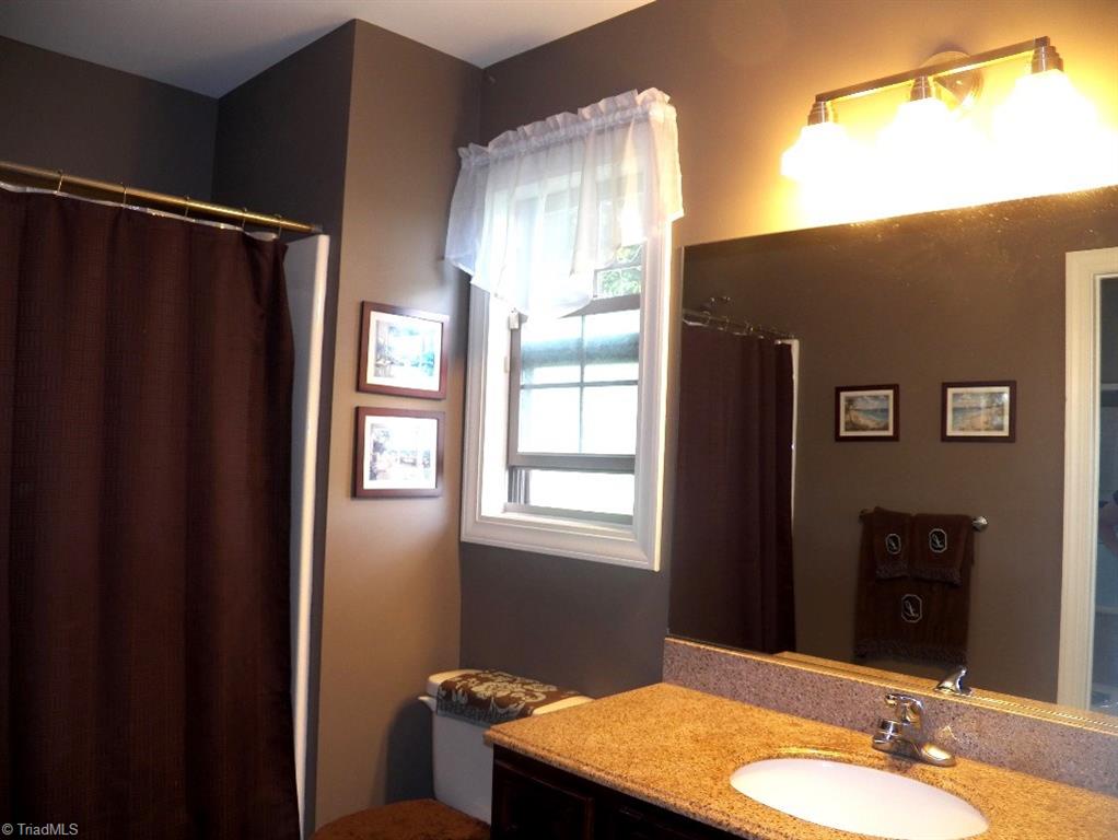 859 Riverview Rd Extension Lexington, NC 27292 - Photo 18 of 26 Another view of the master bathroom. Window lets in natural light and gentle breezes