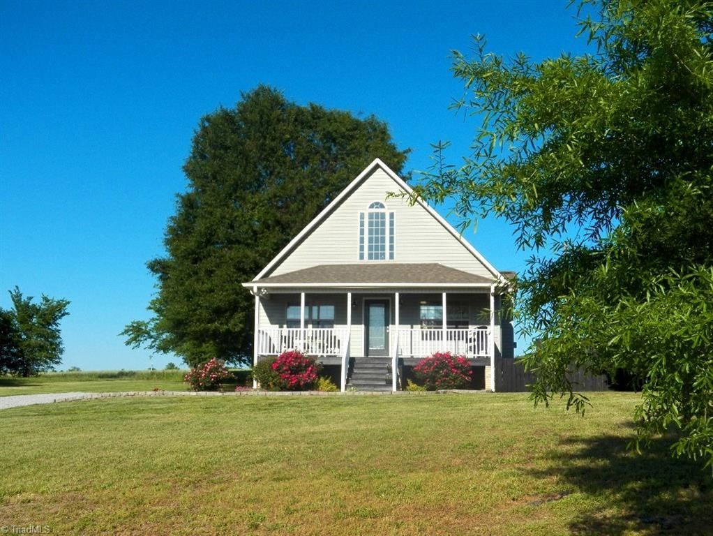 859 Riverview Rd Extension Lexington, NC 27292 - Photo 3 of 26 View of the home from the road. Gentle slope from the house to the road. Large tree in backyard for lots of shade on those hot summer days.