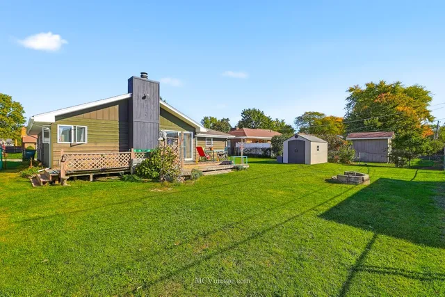a front view of house with yard outdoor seating and green space