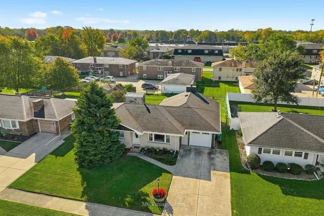 an aerial view of a house with a garden