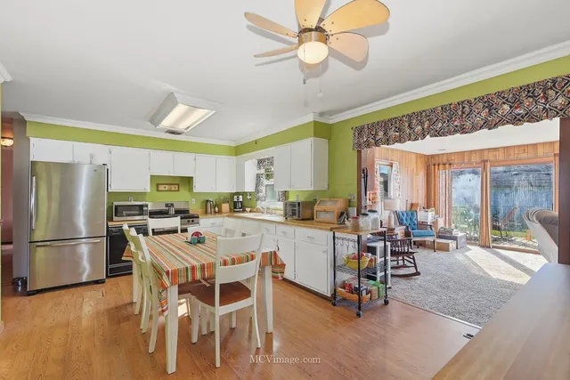 a view of a dining room with furniture window and outside view