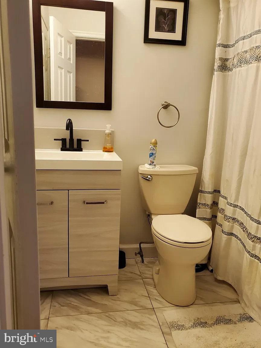 2 Halstead Place Princeton, NJ 08540 - Photo 13 of 16 a bathroom with a toilet sink and mirror