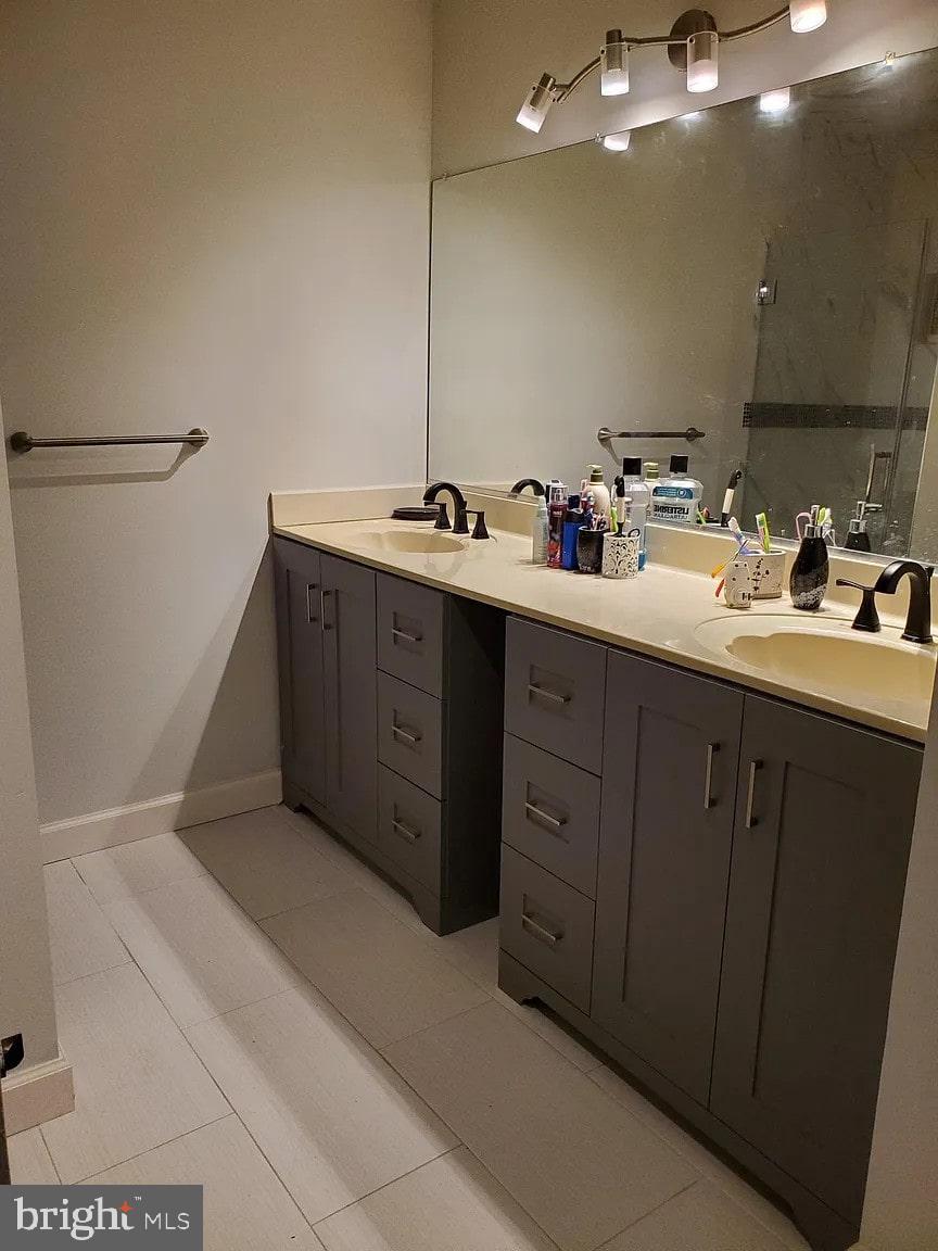 2 Halstead Place Princeton, NJ 08540 - Photo 9 of 16 a bathroom with a double vanity sink a and a mirror