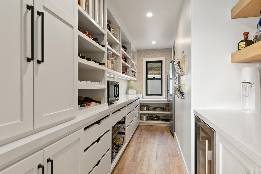 2924 Lone Jack Road Encinitas, CA 92024 - Photo 18 of 48 a kitchen with stainless steel appliances a stove and a refrigerator