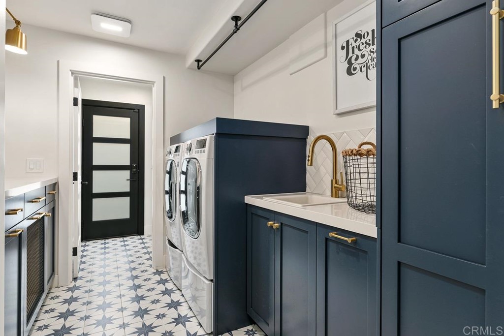 2924 Lone Jack Road Encinitas, CA 92024 - Photo 19 of 48 a kitchen with a refrigerator and a sink
