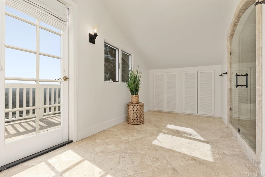 2924 Lone Jack Road Encinitas, CA 92024 - Photo 27 of 48 a view of an entryway with wooden floor and windows