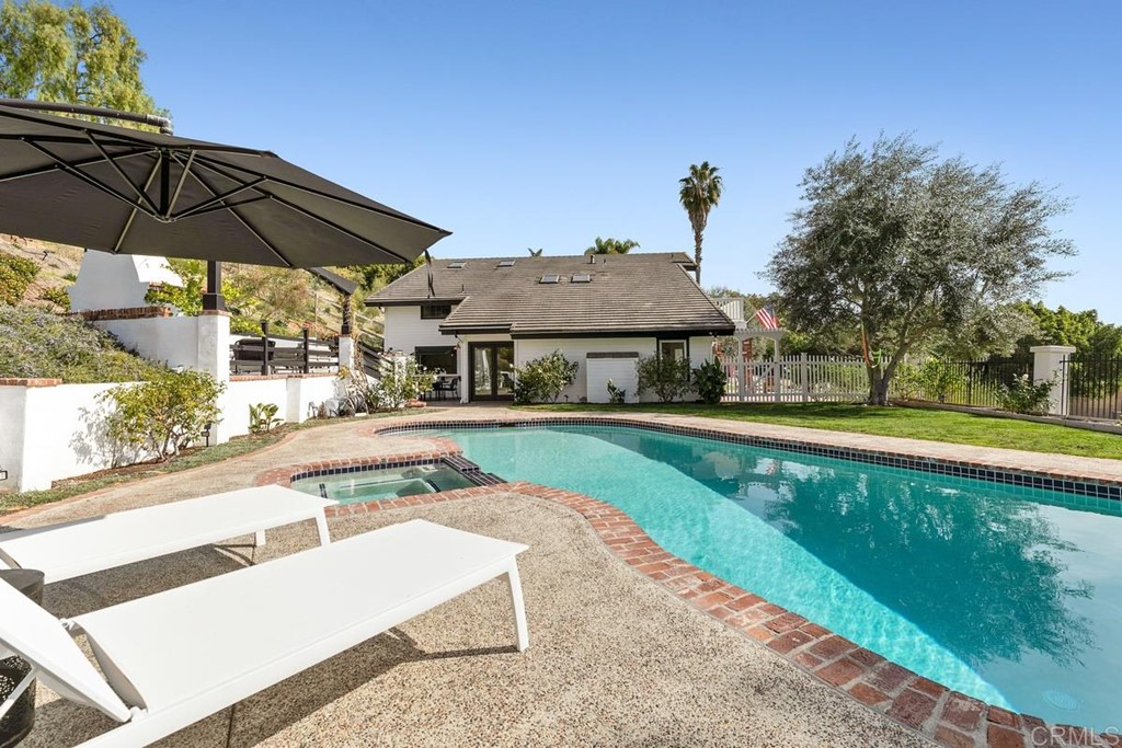 2924 Lone Jack Road Encinitas, CA 92024 - Photo 31 of 48 a view of a house with swimming pool and sitting area