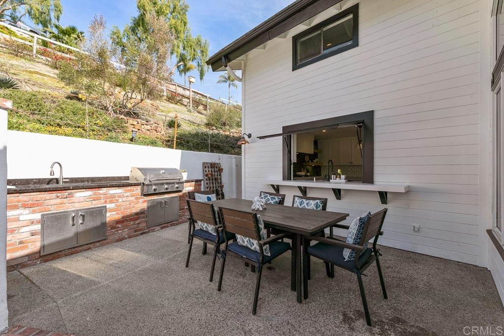 2924 Lone Jack Road Encinitas, CA 92024 - Photo 35 of 48 a outdoor dining space with furniture and a kitchen