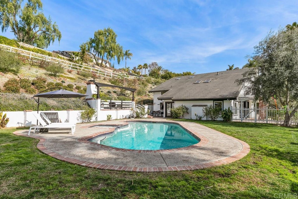 2924 Lone Jack Road Encinitas, CA 92024 - Photo 36 of 48 a view of a swimming pool with a yard