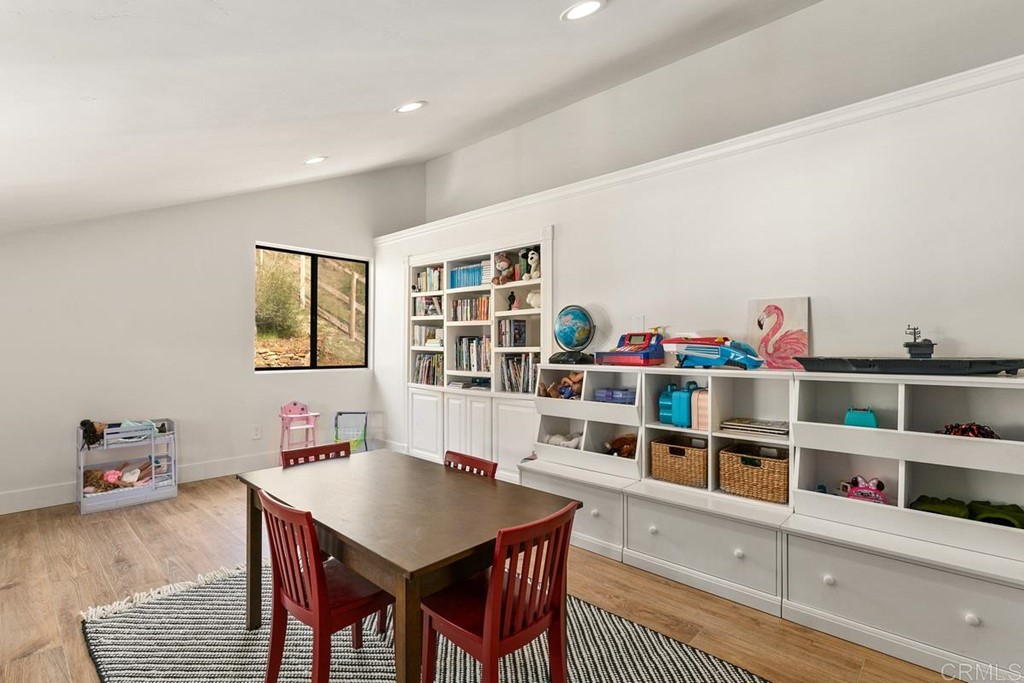 2924 Lone Jack Road Encinitas, CA 92024 - Photo 41 of 48 a room with furniture and a book shelf