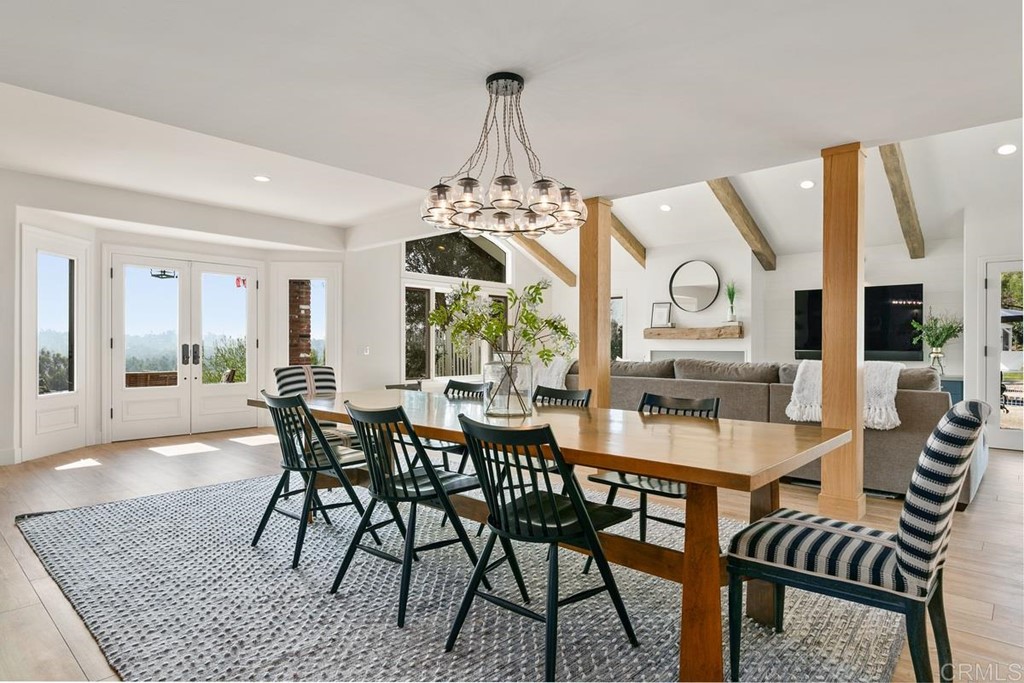 2924 Lone Jack Road Encinitas, CA 92024 - Photo 5 of 48 a view of a dining room with furniture window and wooden floor