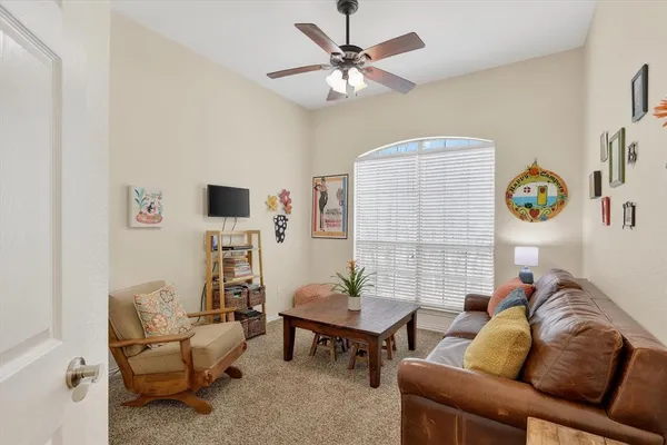 a living room with furniture and a table