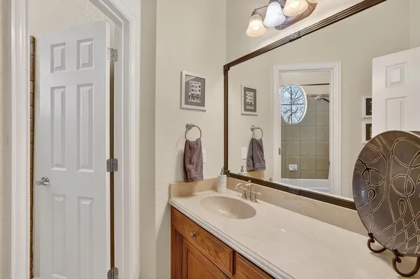 a bathroom with a sink and a mirror
