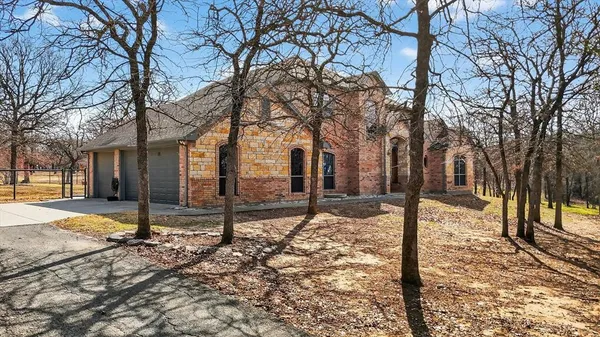 a view of a house with snow on the road
