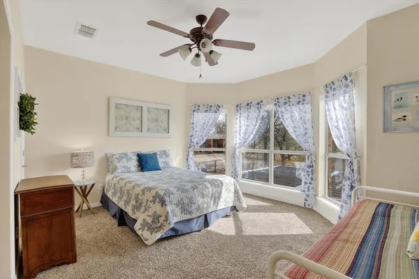 a bedroom with a bed and a view of bedroom