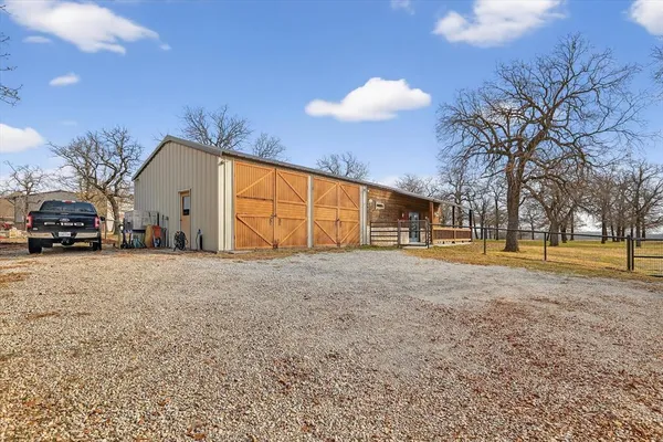 a view of a house with a yard and garage