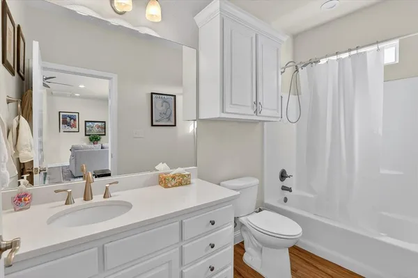 a bathroom with a sink toilet and shower