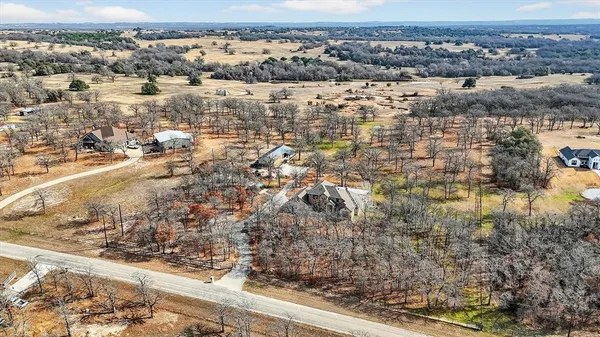 an aerial view of house with yard