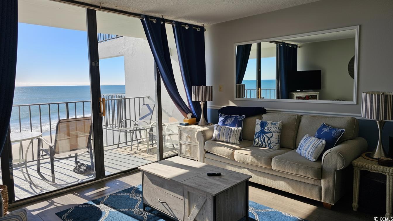 1210 North Waccamaw Drive, Unit 512 Murrells Inlet, SC 29576 - Photo 5 of 20 Living area with wood finished floors