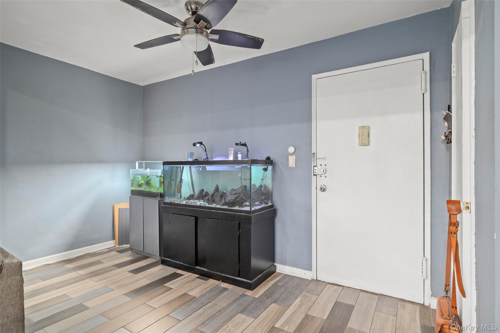 504 Merrick Road, Unit 2K Lynbrook, NY 11563 - Photo 14 of 20 wooden floor in an empty room