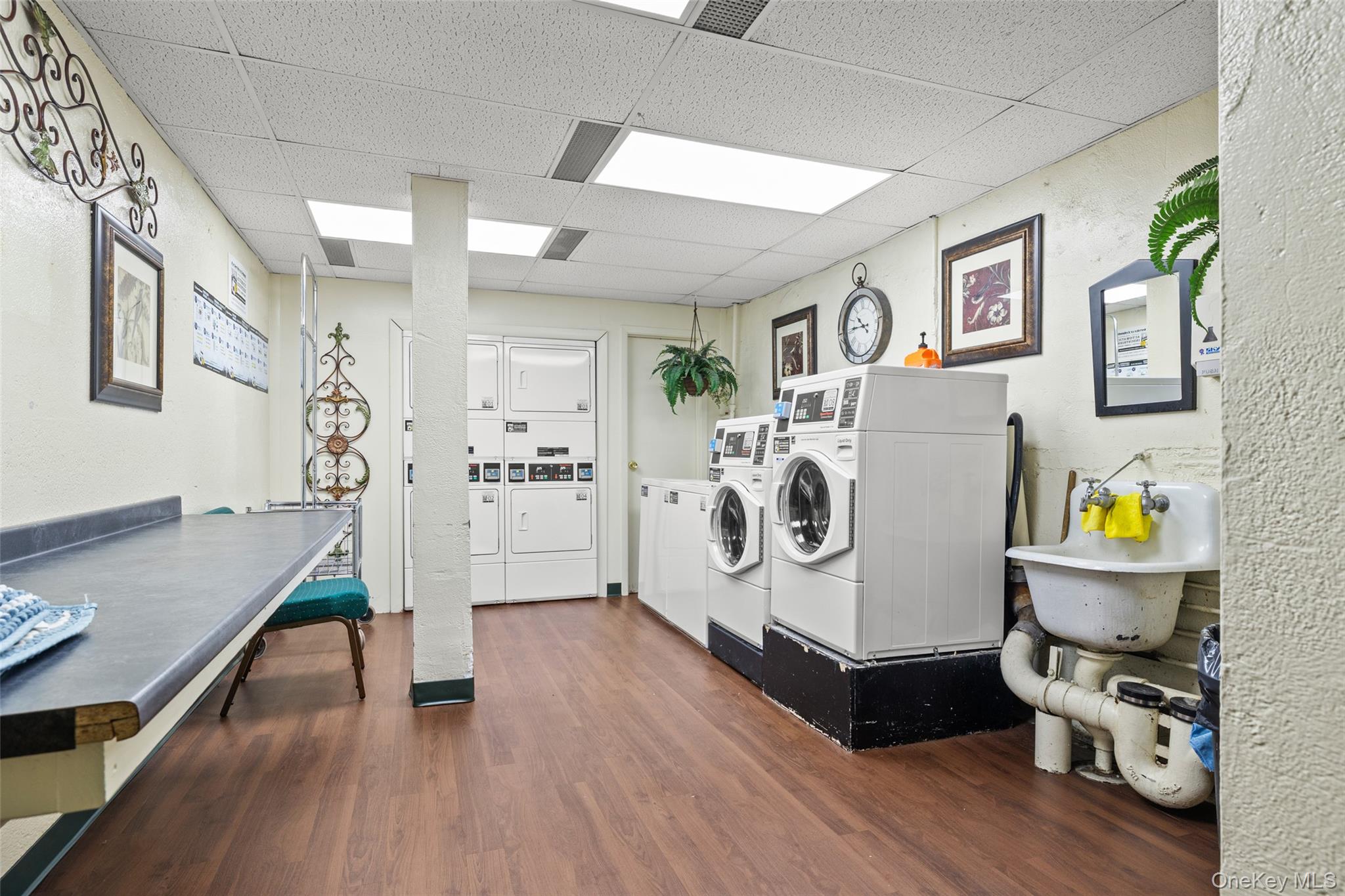 504 Merrick Road, Unit 2K Lynbrook, NY 11563 - Photo 15 of 20 a living room with furniture and wooden floor