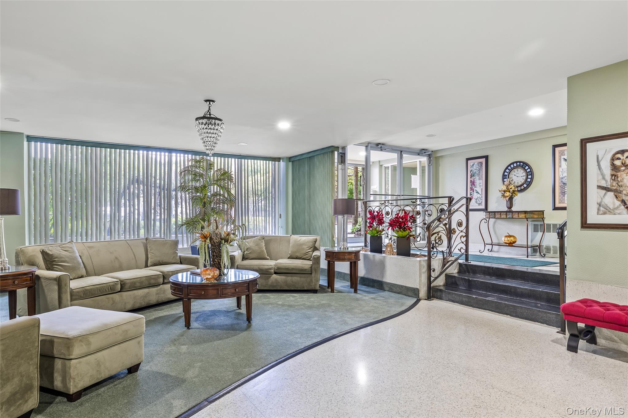 504 Merrick Road, Unit 2K Lynbrook, NY 11563 - Photo 3 of 20 a living room with furniture and a large window