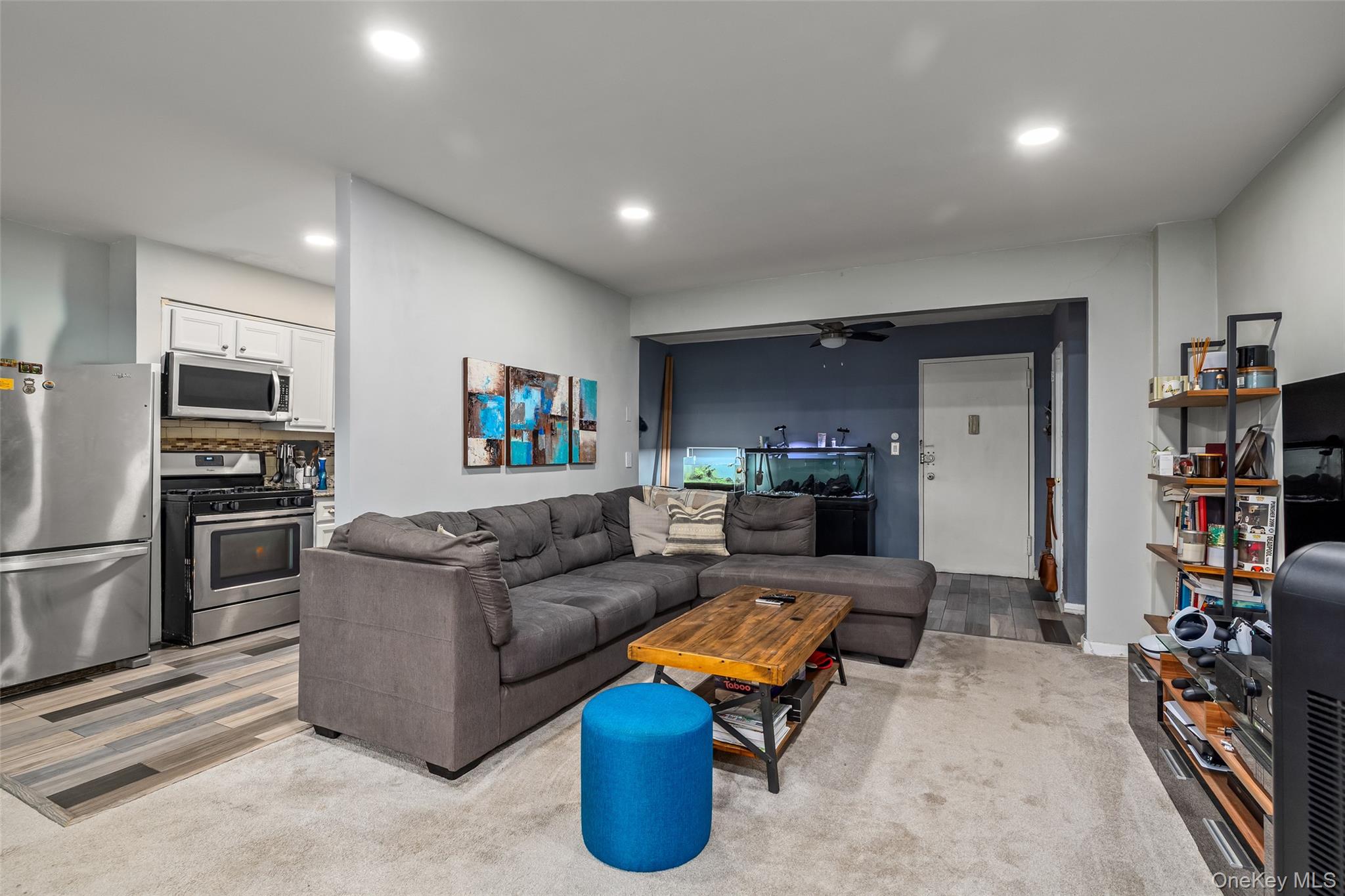504 Merrick Road, Unit 2K Lynbrook, NY 11563 - Photo 5 of 20 a living room with furniture and a wooden floor