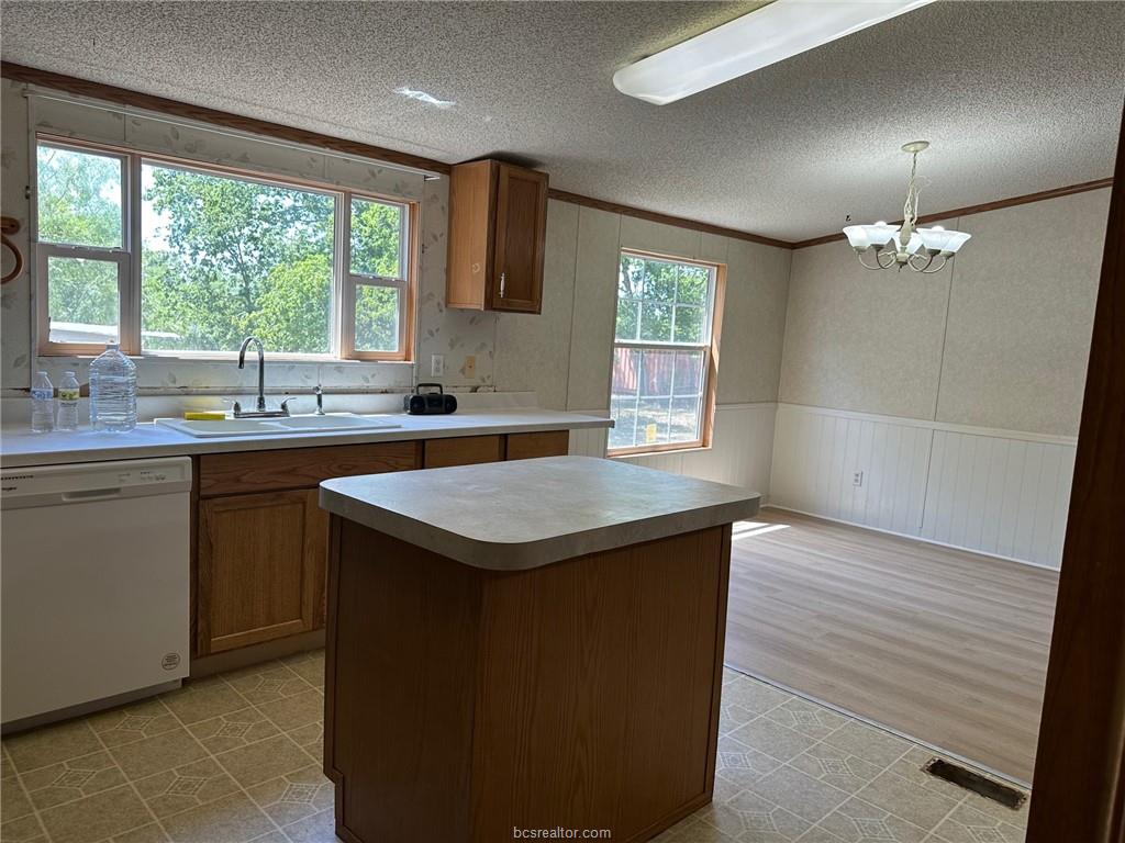 3180 Henderson Road Millican, TX 77868 - Photo 3 of 10 a kitchen with a sink window and cabinets