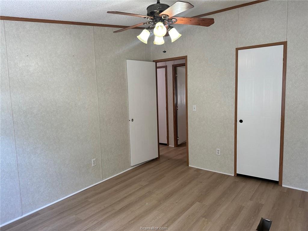 3180 Henderson Road Millican, TX 77868 - Photo 9 of 10 a view of an empty room and chandelier fan