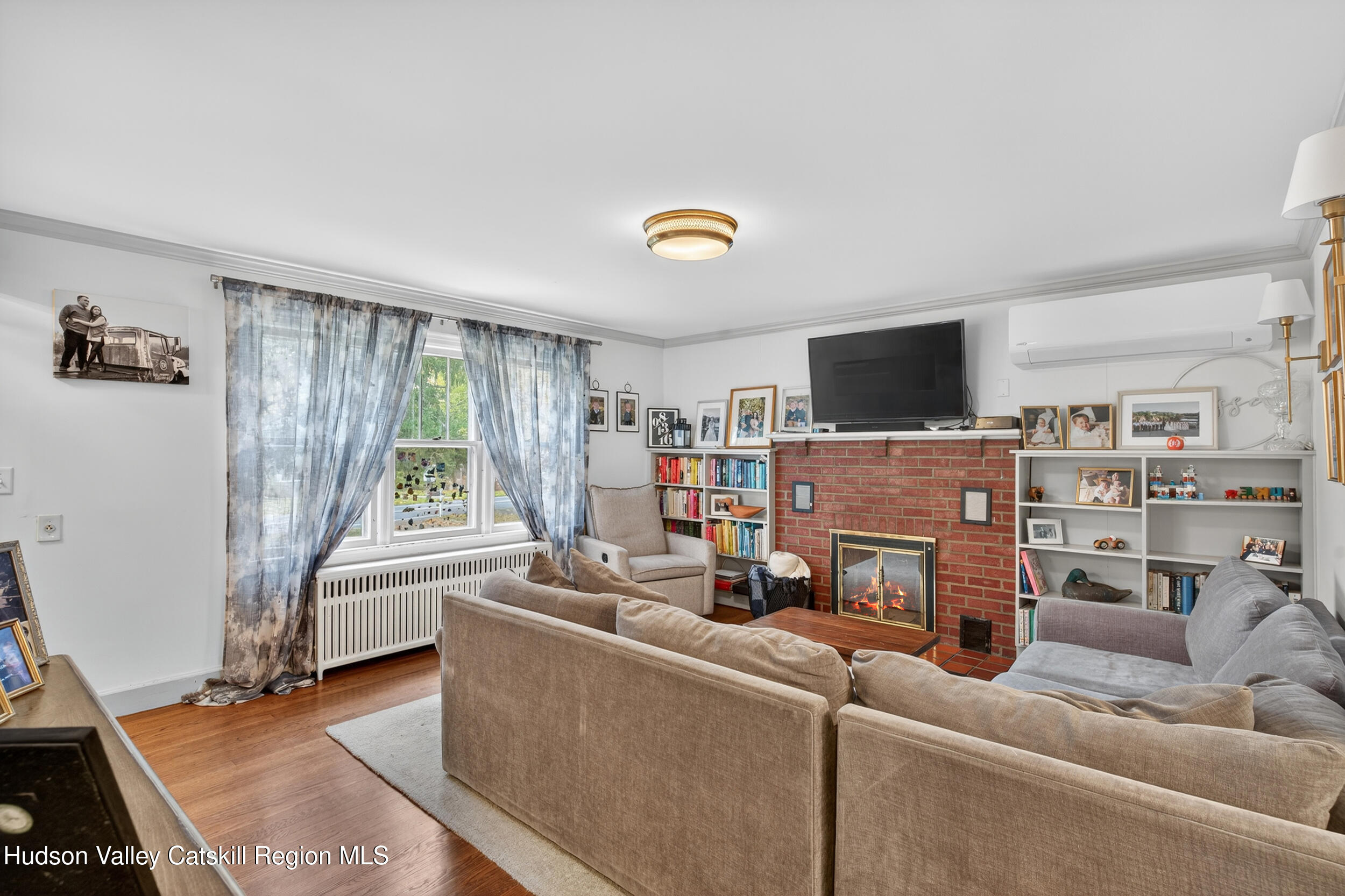 41 New Paltz Road Highland, NY 12528 - Photo 4 of 42 a living room with furniture and a flat screen tv