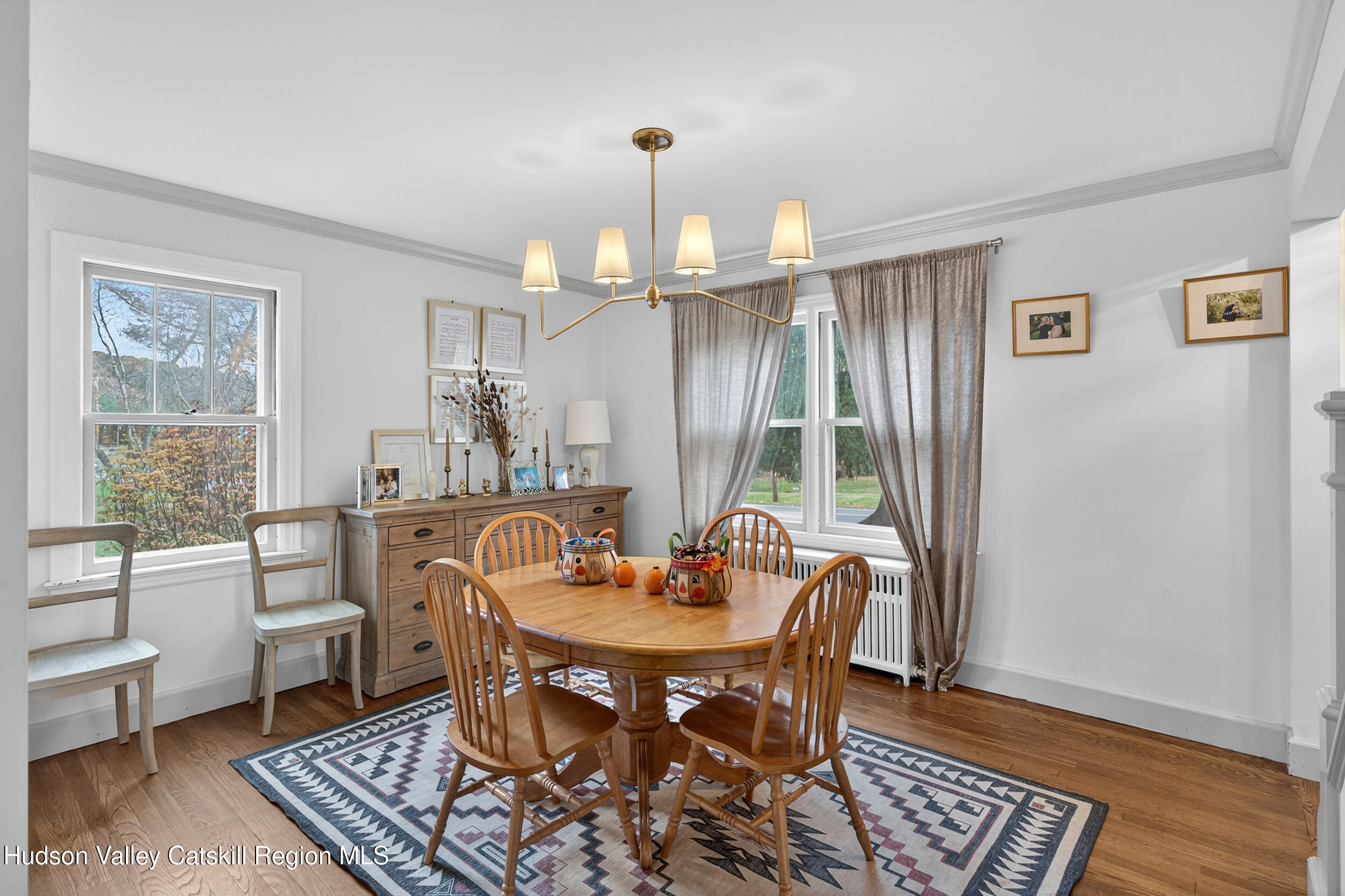 41 New Paltz Road Highland, NY 12528 - Photo 8 of 42 a dining room with furniture a chandelier and wooden floor