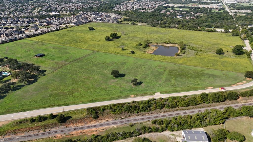 Lot 4 Hickory Hill Road Argyle, TX 76226 - Photo 5 of 11 a view of a large body of water with a building in the background