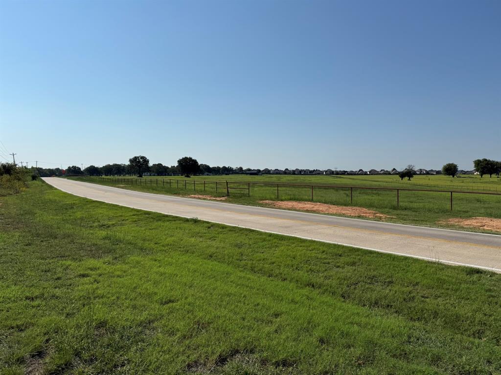 Lot 4 Hickory Hill Road Argyle, TX 76226 - Photo 6 of 11 a view of a golf course with a lake