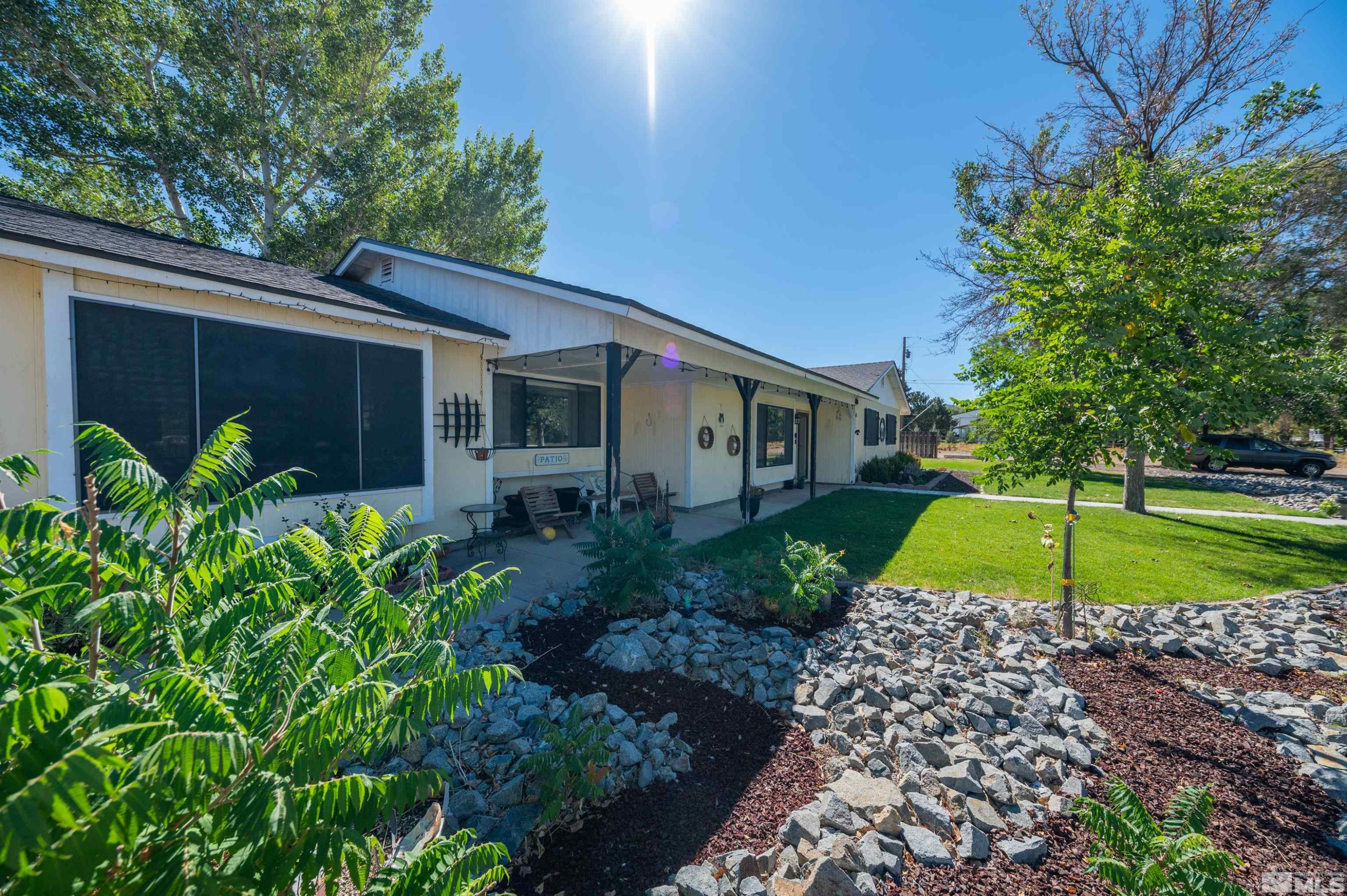 a view of a house and a yard