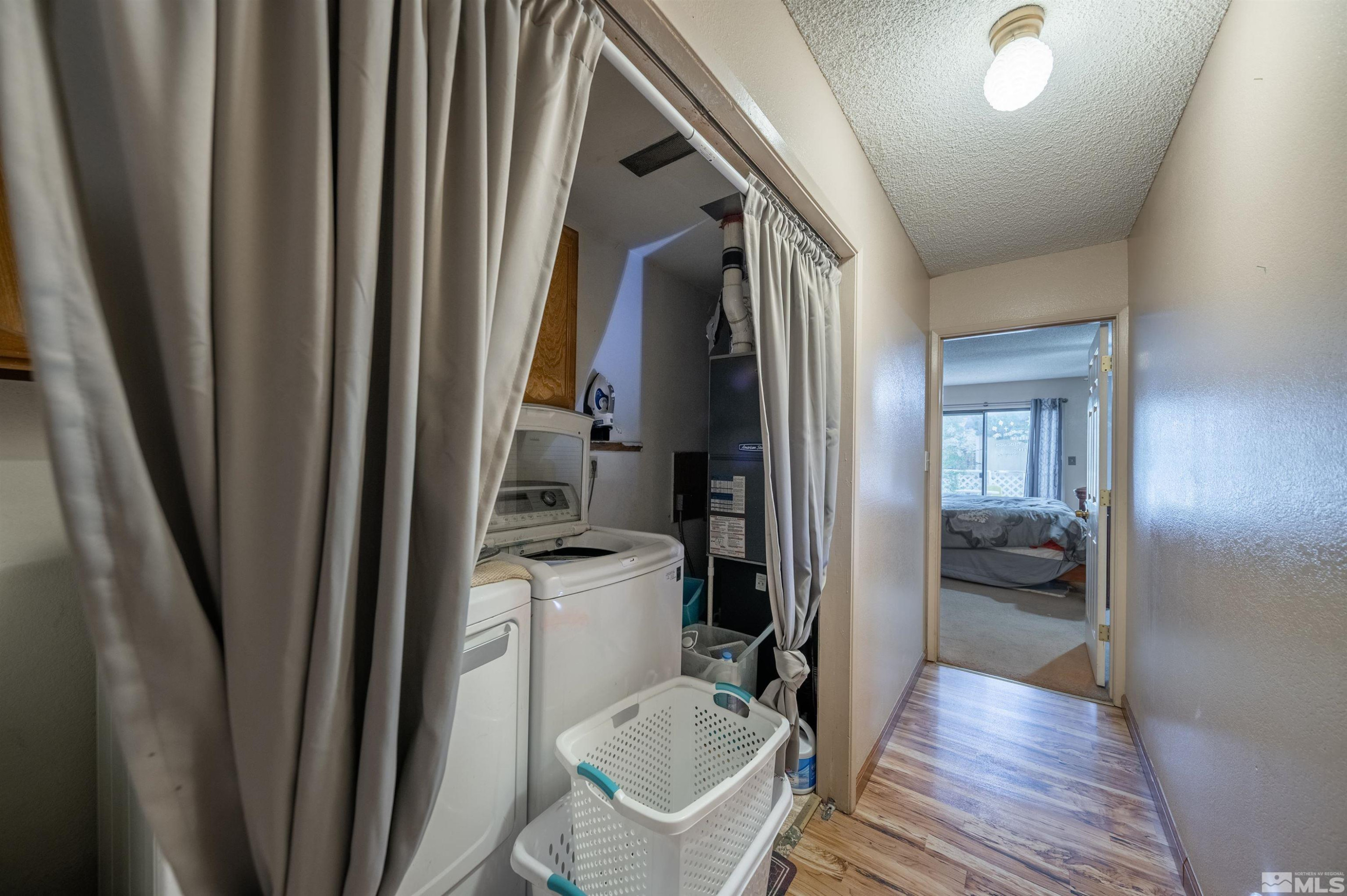 10880 Deodar Way Reno, NV 89506 - Photo 13 of 38 a bathroom with a sink a toilet and shower