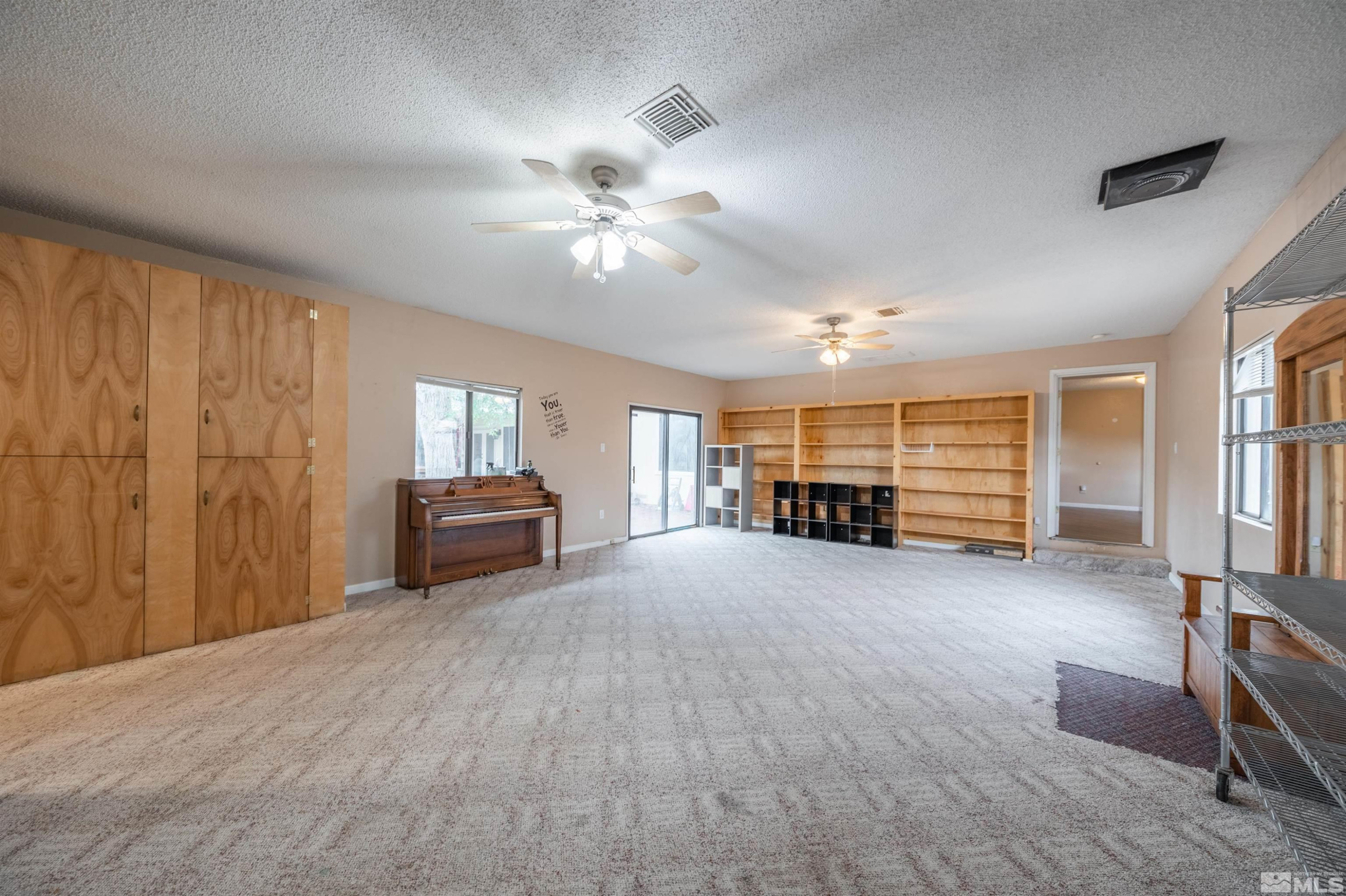 10880 Deodar Way Reno, NV 89506 - Photo 18 of 38 a living room with furniture and a window