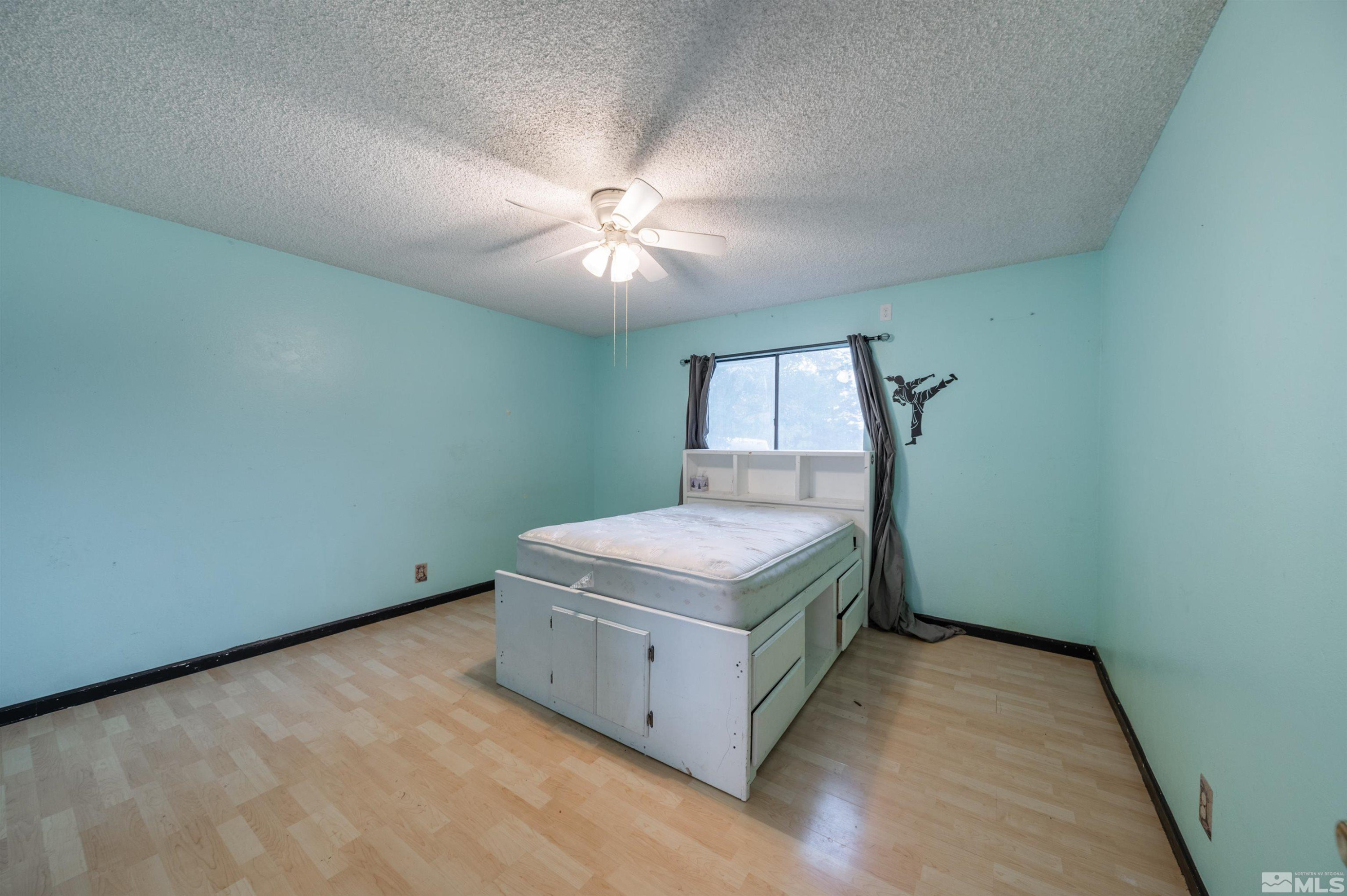 10880 Deodar Way Reno, NV 89506 - Photo 26 of 38 a room with a stove and a fan