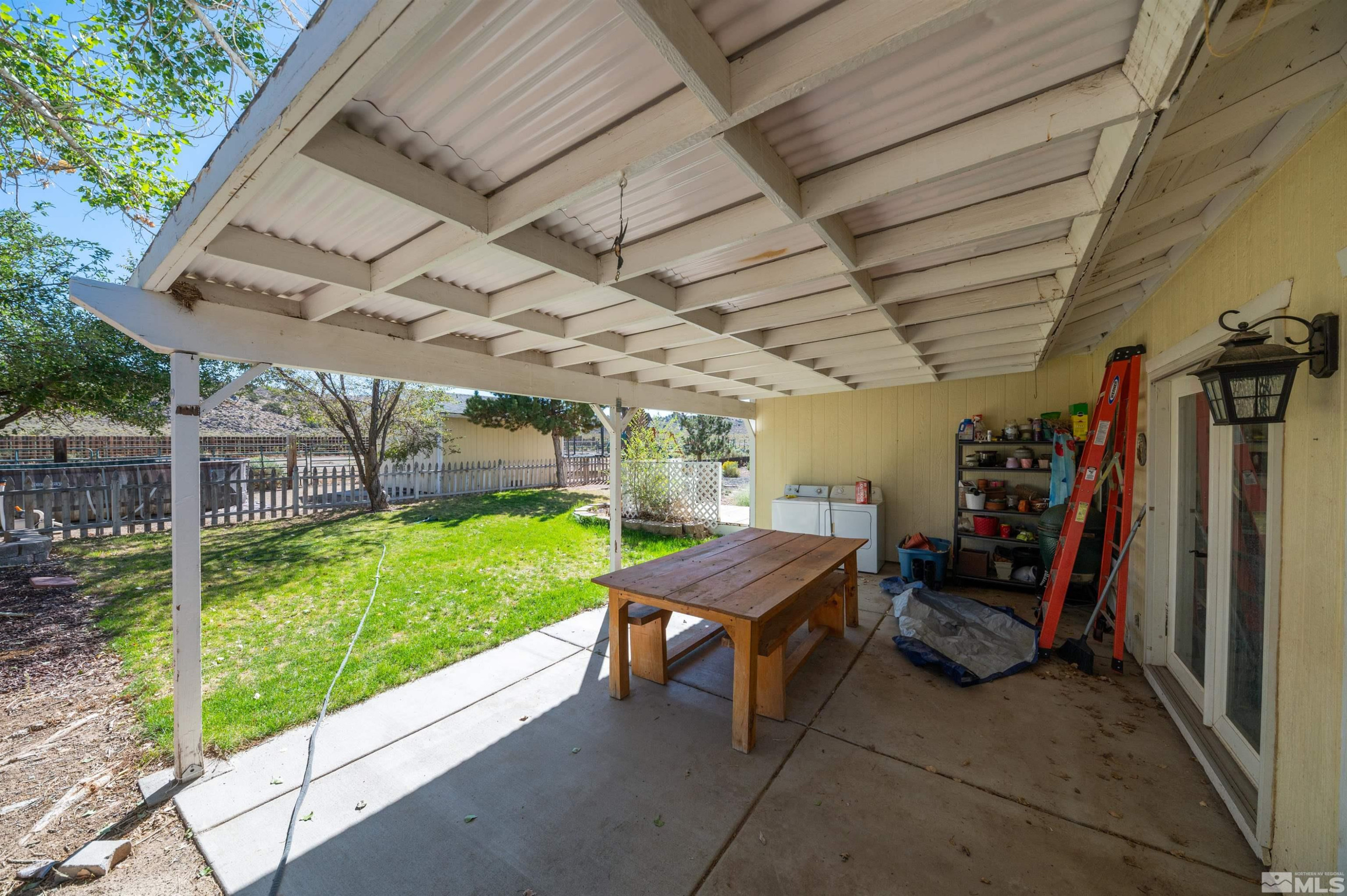 10880 Deodar Way Reno, NV 89506 - Photo 28 of 38 a view of a backyard with furniture and a garden