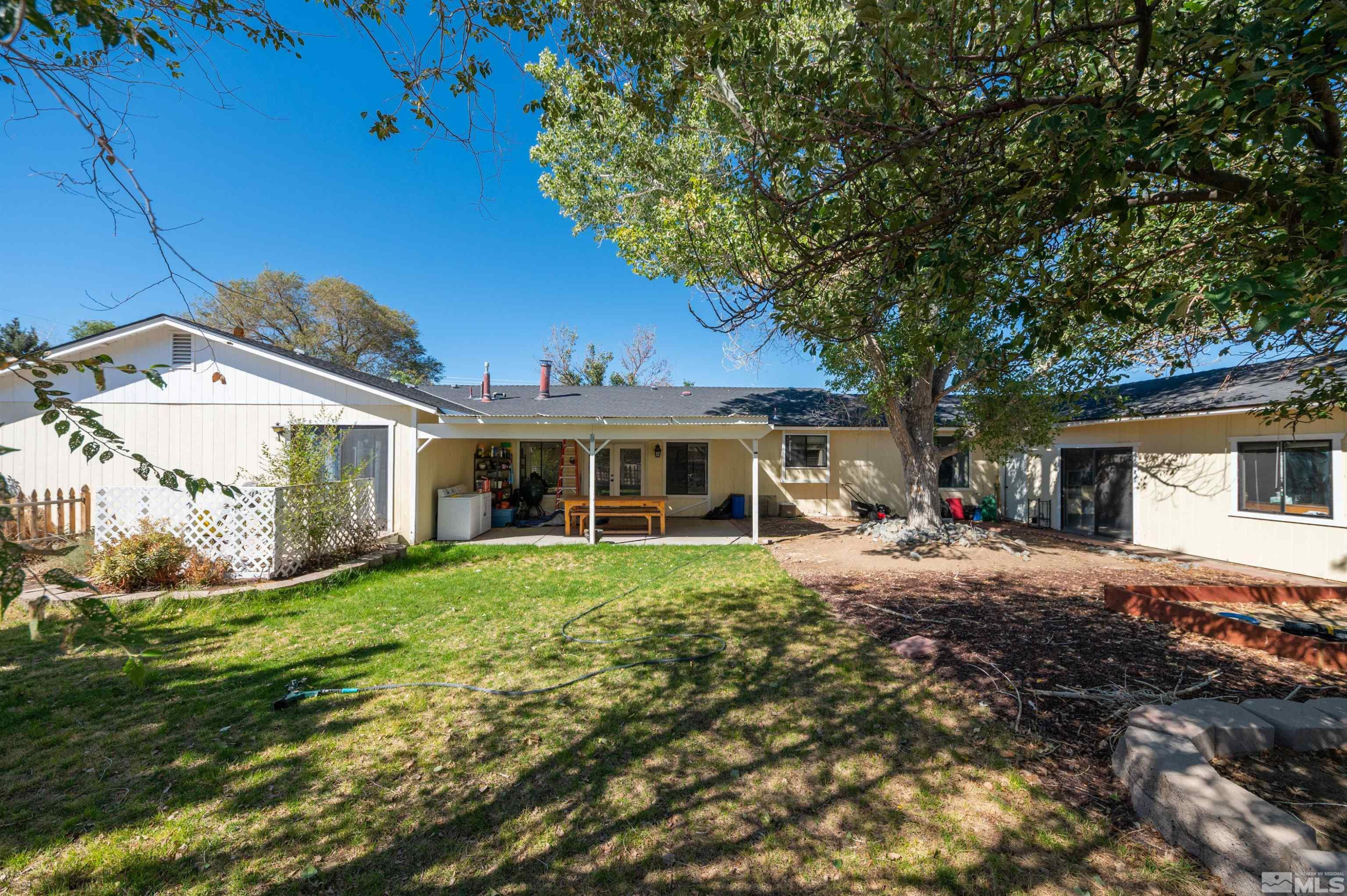 10880 Deodar Way Reno, NV 89506 - Photo 29 of 38 a front view of a house with a garden