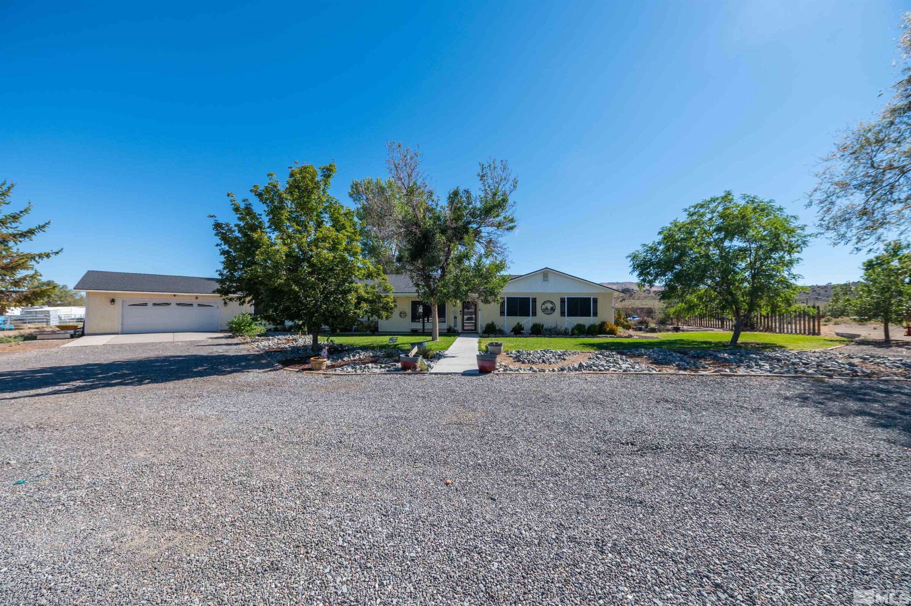 10880 Deodar Way Reno, NV 89506 - Photo 38 of 38 a view of a road with a house in the background