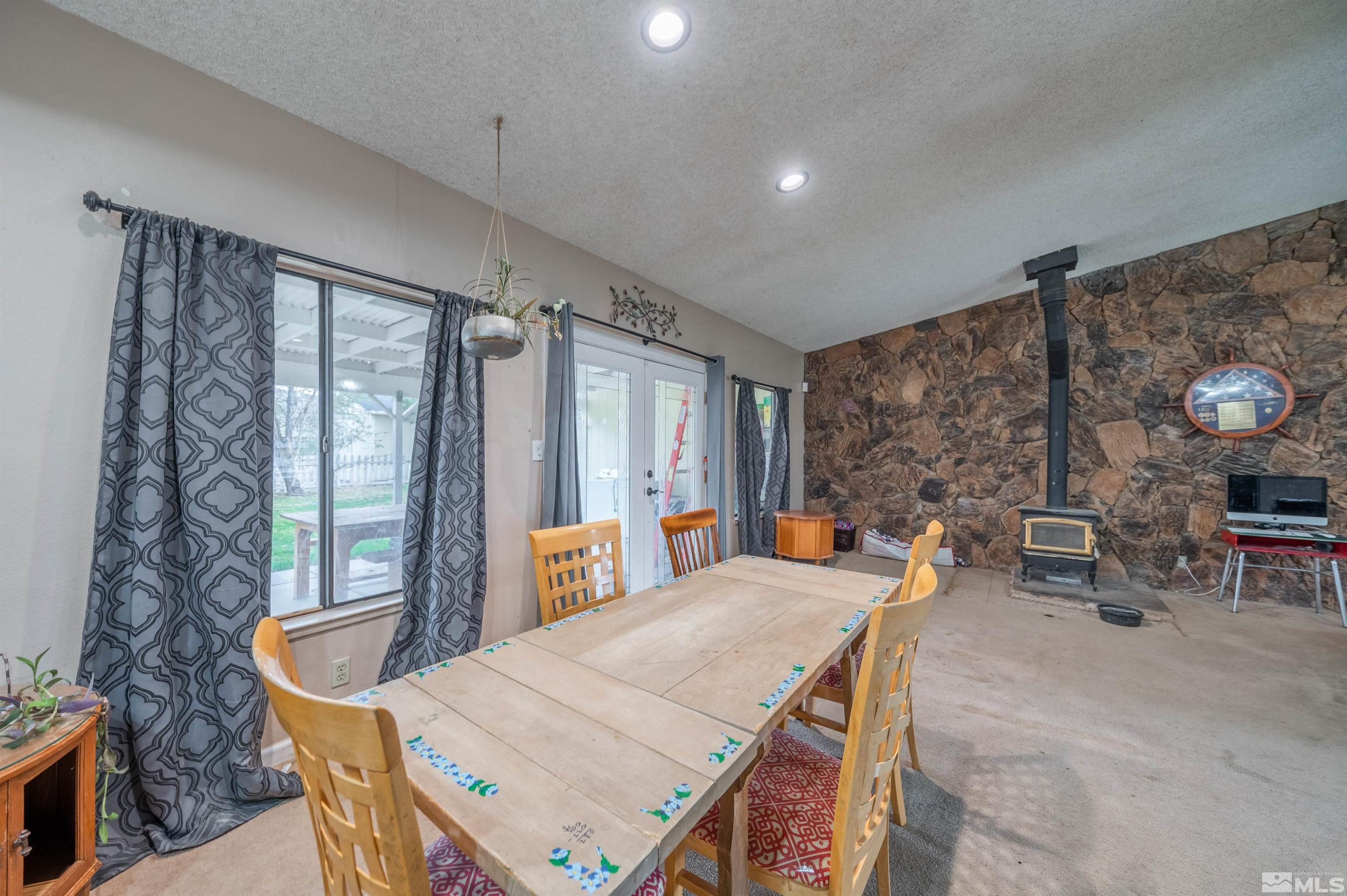 10880 Deodar Way Reno, NV 89506 - Photo 7 of 38 a view of a dining room with furniture window and outside view