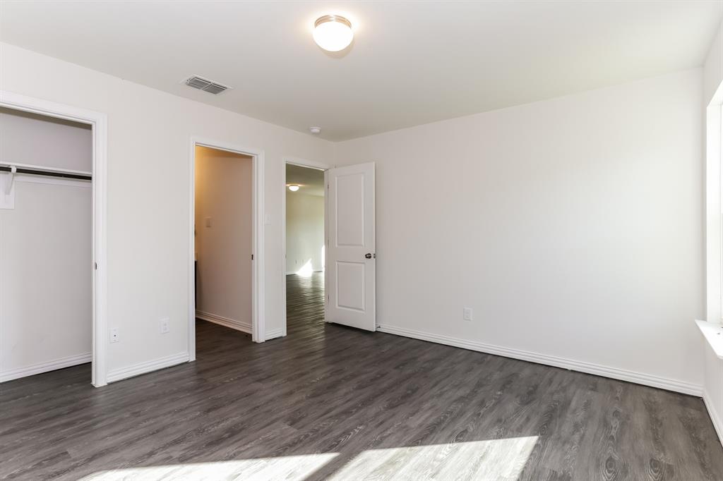 408 Jonathan Street Athens, TX 75751 - Photo 11 of 21 a view of an empty room with wooden floor