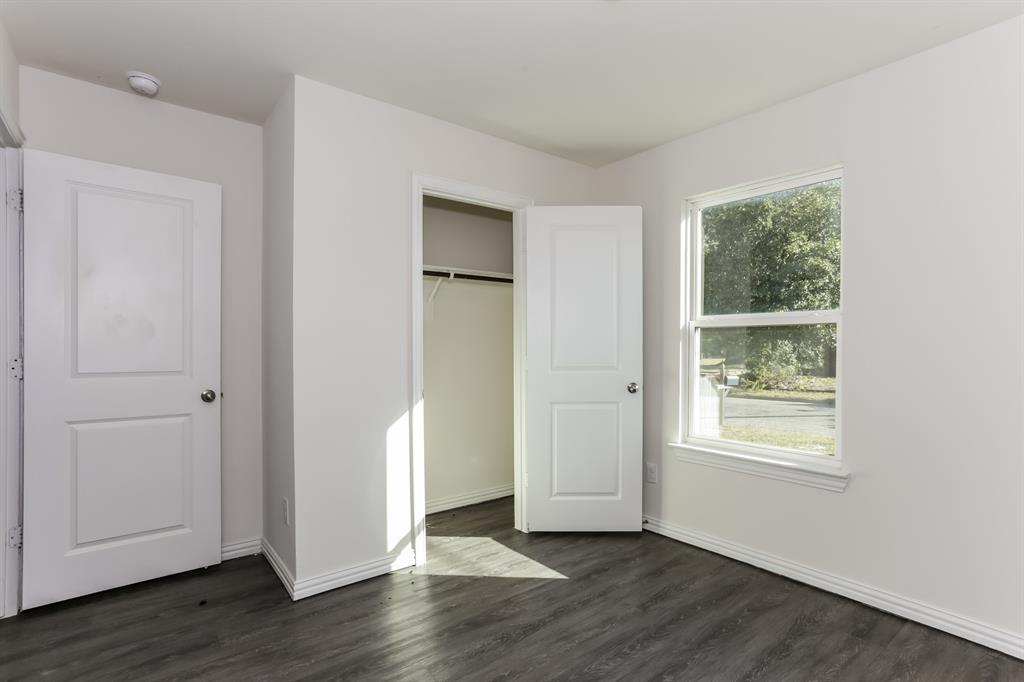 408 Jonathan Street Athens, TX 75751 - Photo 15 of 21 a view of an empty room with wooden floor and a window