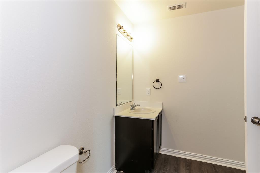 408 Jonathan Street Athens, TX 75751 - Photo 18 of 21 a bathroom with a sink toilet and mirror