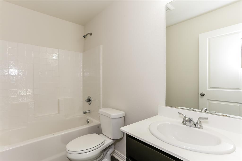 408 Jonathan Street Athens, TX 75751 - Photo 19 of 21 a bathroom with a sink a toilet and shower