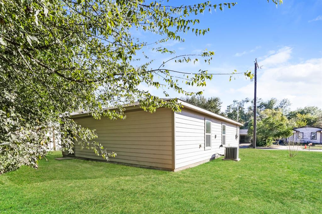 408 Jonathan Street Athens, TX 75751 - Photo 20 of 21 a view of a backyard with a tree
