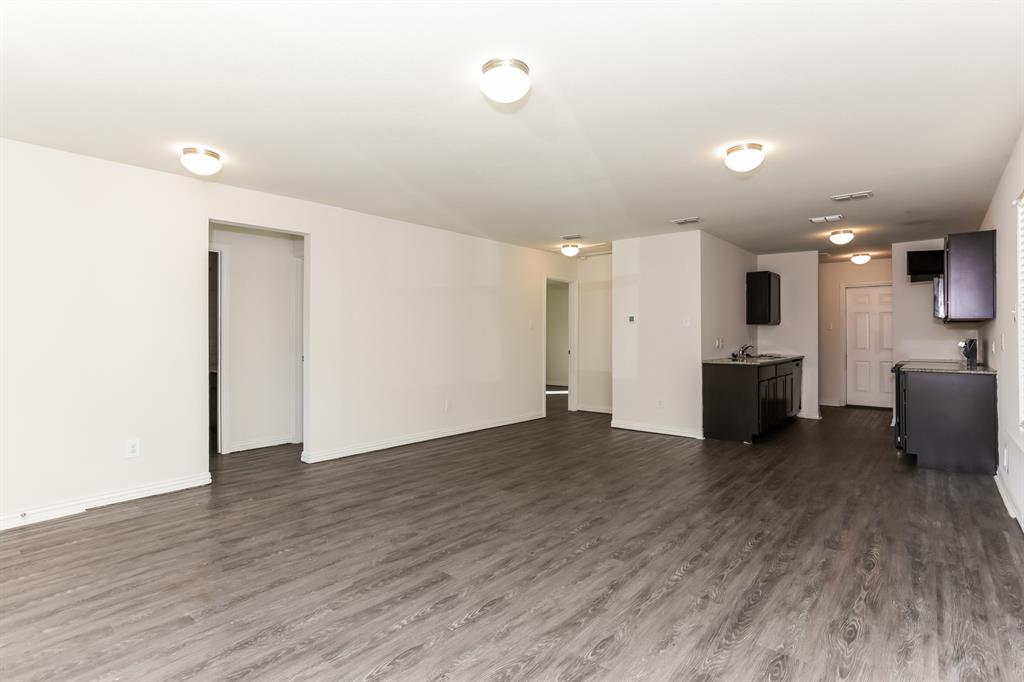 408 Jonathan Street Athens, TX 75751 - Photo 6 of 21 a view of a kitchen with a sink and a refrigerator